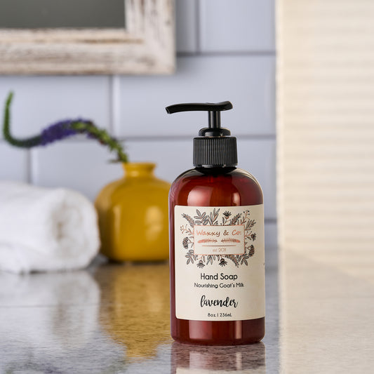Hand soap bottle with a label on a bathroom counter